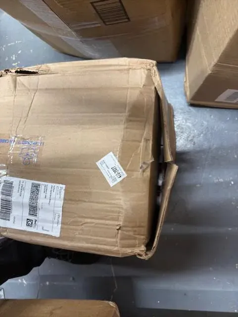 A crushed, torn shipping box